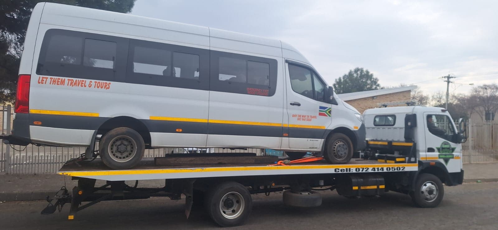 Minibus loaded on a Bloem Towing flatbed truck